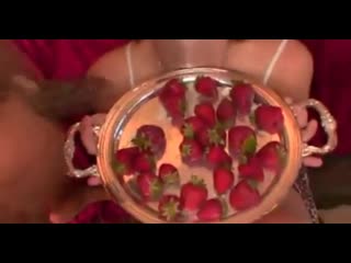 girl eats strawberries with sperm